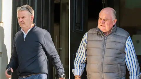 It shows pictures of two men. The one on the left is wearing a white shirt under a dark zip-up top and light blue trousers. He is wearing a watch on his left wrist and carrying a mobile phone in his right hand. The man on the right is wearing a blue and yellow striped shirt with the sleeves rolled up under a zip-up grey sleeveless top. He has a silver bracelet on his right wrist