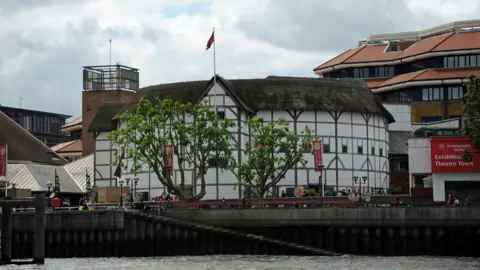 The globe Theatre on banks of the Thames