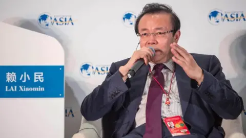 Getty Images Lai Xiaomin, then chairman of China Huarong Asset Management Co., speaking during the Boao Forum for Asia Annual Conference 2016.