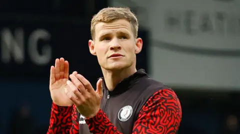 Bristol City defender Rob Atkinson applauding the fans post-match.