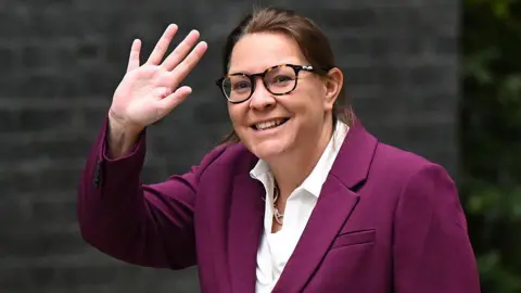 Anna Turley arriving for a UK cabinet meeting last autumn. She is smiling and waving at the camera in Downing Street.