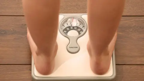 Child standing on scales