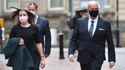 PA Media West Mercia Police Constables Benjamin Monk (right) and Mary Ellen Bettley-Smith (left) arrive at Birmingham Crown Court to stand trial