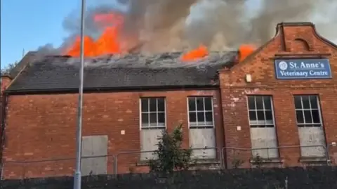 Our Bassetlaw Flames rise from roof of brick building