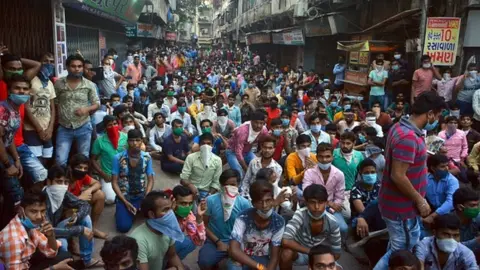 Getty Images Textile workers protest in Surat city on 14th April