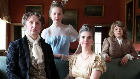 National Trust/Jason Lock Gary Winters and Grace Surman with children Hope and Merrick