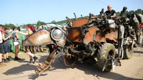 PA Media Extinction Rebellion march at Glastonbury Festival