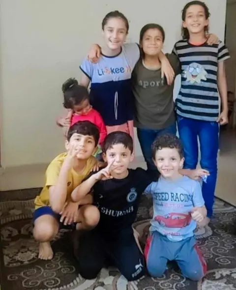 Family handout Alma (C) with her cousins before they were killed in a reported Israeli air strike in Gaza City in December 2023