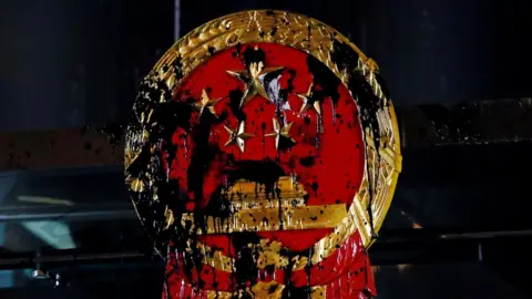 Reuters A National Emblem splashed with paint after anti-extradition bill protest is seen outside Chinese Liaison Office in Hong Kong, China, July 21, 2019.