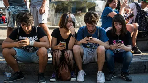 Getty Images people on phones