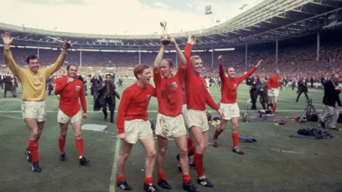 Getty Images England players celebrate their 1966 World Cup win at Wembley