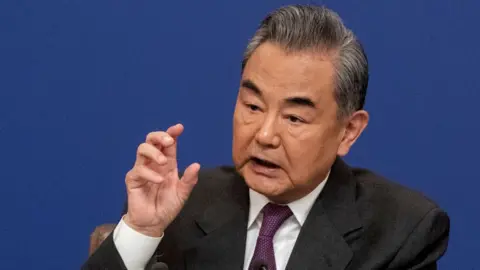 Getty Images Chinese Foreign Minister Wang Yi speaks during a press conference for domestic and foreign journalists as part of the National People's Congress and Two Sessions on March 7, 2024 in Beijing.