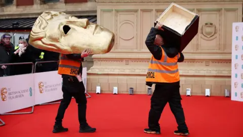 Reuters Members of staffs work ahead of the 75th British Academy of Film and Television Awards (BAFTA) at the Royal Albert Hall in London