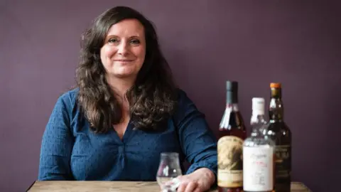 Wah Wah Lab Amy and some whisky bottles