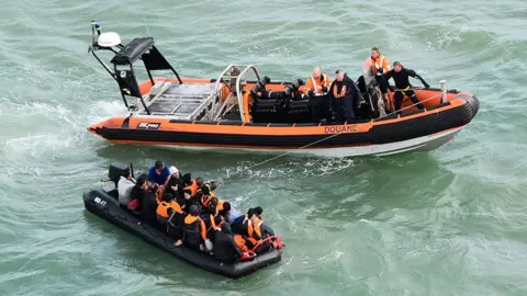 AFP/Marine Nationale Migrants in an inflatable dinghy