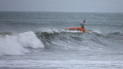 Andy Teal Photography An RNLI all weather lifeboat in rough seas off of the coast of Lynmouth, in Devon