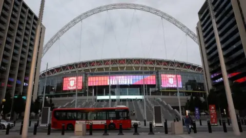 Reuters General view of arch at Wembley Stadium which displays "champions" on electronic display board after England won the UEFA Women's Euro 2025 final
