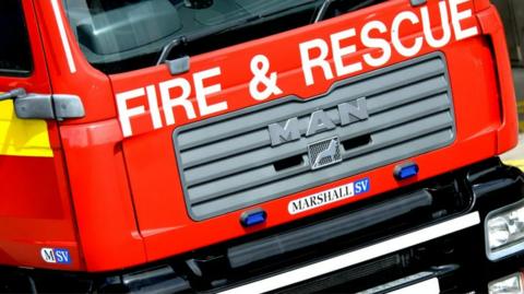 An up close image of the front of a fire engine