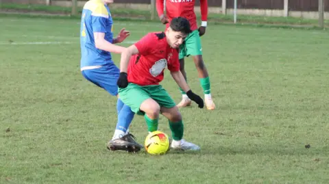 A youth footballer in a game