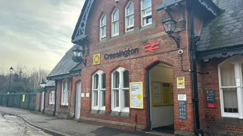 The entrance to Cressington railway station.