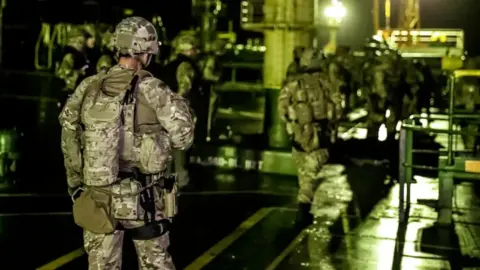 Reuters Royal Marine on Grace 1