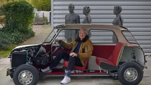 BBC Sir James Dyson sitting in Mini