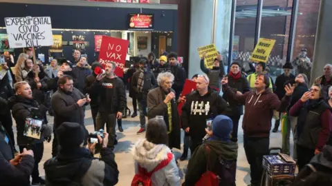 Getty Images Protesters at Milton Keynes Theatre