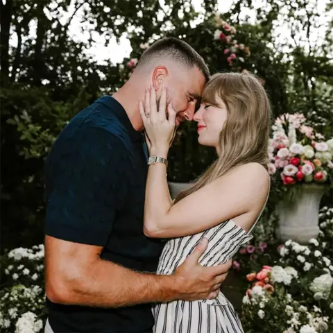 @TAYLORSWIFT Travis Kelce and Taylor Swift embrace each other on the occassion of their engagement
