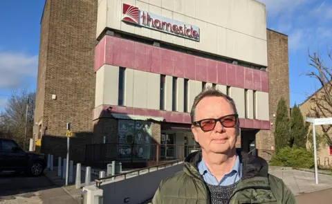 Peter Walker/BBC Neil Woodbridge outside the Thameside theatre complex