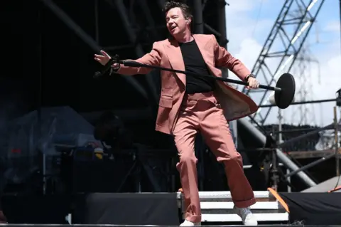 ADAM VAUGHAN/EPA-EFE/REX/Shutterstock Rick Astley performs on the Pyramid Stage at Glastonbury