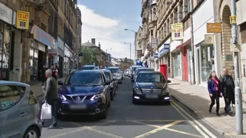 A street with shopfronts visible