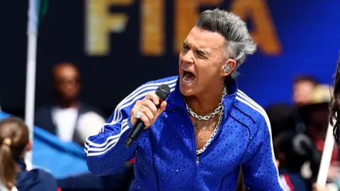 Reuters Robbie Williams perform during the closing ceremony before the match 
