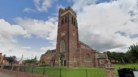Google A Google street view image of the church Katie Simpson and her partner got married in. The churchyard and black railings can be seen in front of the church.