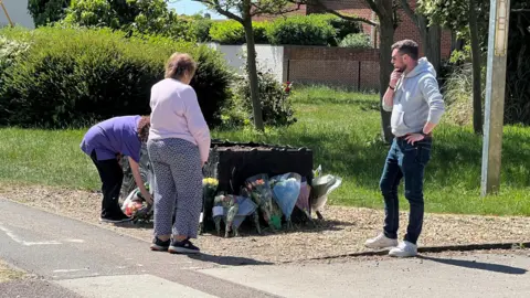 People laying tributes
