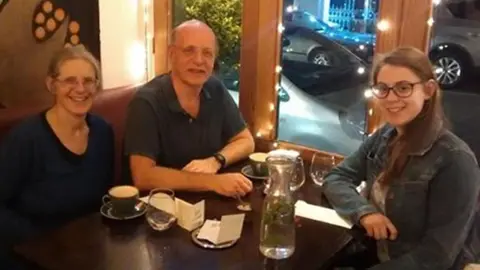 Handout Natasha Abrahart in a restaurant with her family, eating at a restaurant