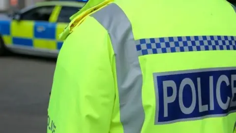 BBC A police jacket with the police name stuck on the back