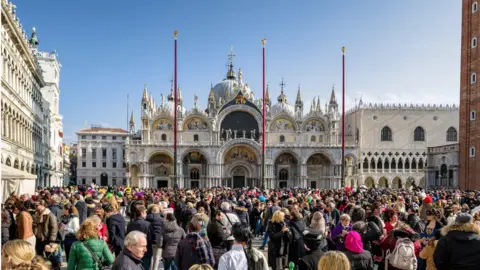 Getty Images A crowded plaza in Venice