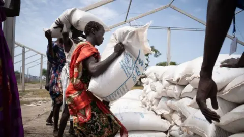 Getty Images A person in South Sudan receiving aid