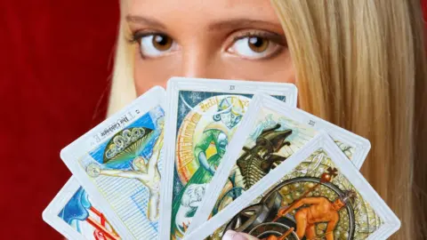 Woman with tarot cards