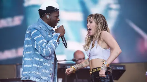 Getty Images Lil Nas X with Miley Cyrus at Glastonbury