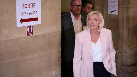 President of far-right party Rassemblement National (RN) parliamentary group Marine Le Pen arrives to attend the verdict in the appeal trial of RN former or actual members on charges of embezzlement