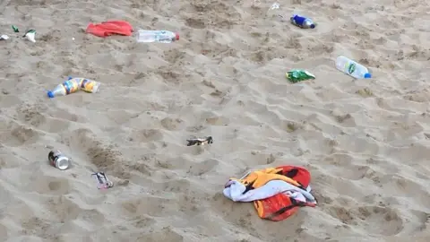 Rob and Claire Curtis Litter left on Barry Island beach