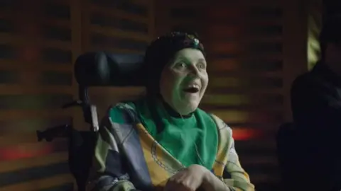 Rosie Johnson using an EEG cap to play music