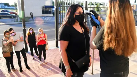 Getty Images Fans had their temperature checked as they entered the venue