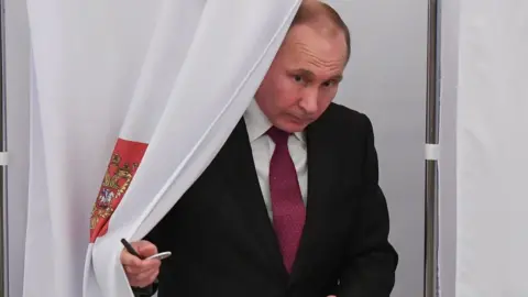 AFP Vladimir Putin votes in Moscow on 18 March 2018