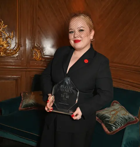 Getty Images Nicola Coughlan holds an award 