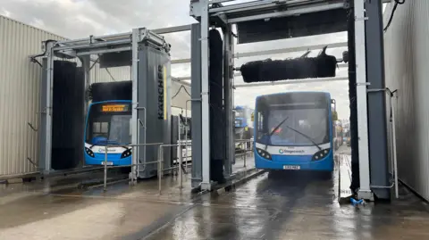 Jozef Hall/BBC Two buses in a new sixty thousand pound washer