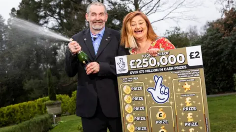 National Lottery Scratchcard winners John Simpson and Michelle Newton