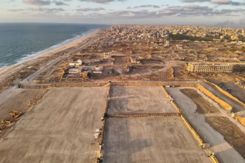 IDF Israeli military handout photo showing a holding area for aid lorries next to the beach where the US floating pier is anchored (16 May 2024)