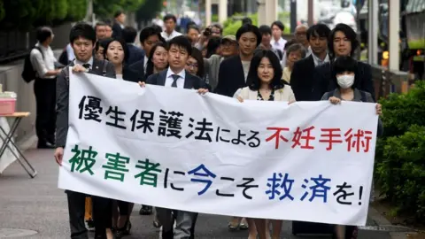 Getty Images Forced sterilisation in Japan - protesters in 2018